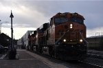 Intermodal cruises west past the station